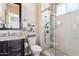 Bathroom featuring a vanity, toilet, and glass enclosed shower with decorative tile at 27000 N Alma School Pkwy # 2019, Scottsdale, AZ 85262