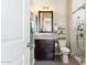 Bathroom with a dark wood vanity, mirror, and glass-enclosed shower at 27000 N Alma School Pkwy # 2019, Scottsdale, AZ 85262