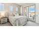 Bedroom with neutral colors, a bed, and a sliding glass door to the balcony at 27000 N Alma School Pkwy # 2019, Scottsdale, AZ 85262