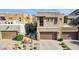 Modern southwestern home with desert landscaping and a two-car garage at 27000 N Alma School Pkwy # 2019, Scottsdale, AZ 85262