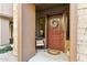 Inviting front entrance with a decorative wreath, stylish door, and charming outdoor seating area at 27000 N Alma School Pkwy # 2019, Scottsdale, AZ 85262