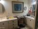 Bathroom featuring matching mirrors above each sink, and drawers for storage at 2744 N Trevino Pl, Mesa, AZ 85215