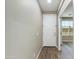 Inviting hallway with wood-look floors and a white front door, leading into a bright living space with natural light at 287 N Jesse St, Chandler, AZ 85225