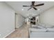 Expansive living room with wood-look flooring, neutral walls, and a glimpse into the open kitchen area at 287 N Jesse St, Chandler, AZ 85225