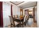 Cozy dining room with seating for six, featuring tile floors and natural light at 2942 E Mulberry Dr, Phoenix, AZ 85016