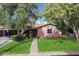 Inviting single-story house with a well-kept lawn and mature trees offering a cool shade at 2942 E Mulberry Dr, Phoenix, AZ 85016