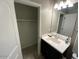 A bathroom with a sink and a view of the closet at 29573 W Mitchell Ave, Buckeye, AZ 85396