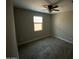 Bedroom with plush carpeting, a window, and natural light at 29573 W Mitchell Ave, Buckeye, AZ 85396