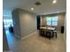 A dining area with a bar height table and black stools at 29573 W Mitchell Ave, Buckeye, AZ 85396