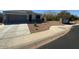 A single-story home featuring desert landscaping with a two-car garage at 29573 W Mitchell Ave, Buckeye, AZ 85396