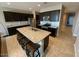 An open-concept kitchen featuring a large island and modern appliances at 29573 W Mitchell Ave, Buckeye, AZ 85396