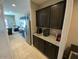 A kitchen area with espresso cabinets and granite countertops at 29573 W Mitchell Ave, Buckeye, AZ 85396