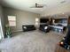 Open-concept living room with plush carpeting and a view of the kitchen at 29573 W Mitchell Ave, Buckeye, AZ 85396