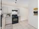 A kitchen with light gray cabinets and a black gas stove at 3034 W San Miguel Ave, Phoenix, AZ 85017