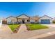 Charming single-story home with well-manicured lawn and brick pathway leading to the inviting front entrance at 3312 E Sells Dr, Phoenix, AZ 85018