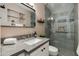 Modern bathroom featuring a glass-enclosed shower, and vanity with neutral countertops at 3350 W Charter Oak Rd, Phoenix, AZ 85029