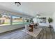 Bright dining room with a view of the backyard pool and modern furnishings at 3350 W Charter Oak Rd, Phoenix, AZ 85029