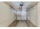 Clean, empty garage with a white door, ready for parking or storage at 3350 W Charter Oak Rd, Phoenix, AZ 85029