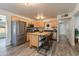 Bright kitchen with stainless steel appliances, wood cabinets, and a kitchen island with bar seating at 3350 W Charter Oak Rd, Phoenix, AZ 85029