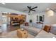 Open-concept living room connected to the kitchen, featuring a large sectional sofa and modern decor at 3350 W Charter Oak Rd, Phoenix, AZ 85029