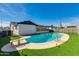 Beautiful backyard pool with diving board, lush turf, and a view of the home at 3350 W Charter Oak Rd, Phoenix, AZ 85029