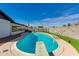 Sparkling pool with diving board and artificial turf in a well-maintained backyard at 3350 W Charter Oak Rd, Phoenix, AZ 85029