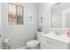 Cozy powder room with a toilet and a simple sink at 337 E Clairidge Dr, San Tan Valley, AZ 85143