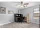 Bedroom with a ceiling fan and a gray floor, furnished with an office desk and drawers at 337 E Clairidge Dr, San Tan Valley, AZ 85143