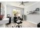 Bright bedroom furnished with two black salon chairs and an adjustable salon mirror at 337 E Clairidge Dr, San Tan Valley, AZ 85143