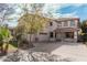 Stately two-story home with a three-car garage and inviting curb appeal on a sunny day at 337 E Clairidge Dr, San Tan Valley, AZ 85143