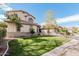 Charming home featuring lush green lawn, mature trees, and well-manicured landscaping at 337 E Clairidge Dr, San Tan Valley, AZ 85143