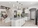 Contemporary kitchen with a central island, modern appliances, and direct access to the staircase at 337 E Clairidge Dr, San Tan Valley, AZ 85143