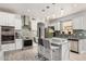 Well-equipped kitchen featuring stainless steel appliances, a center island, and a stylish backsplash at 337 E Clairidge Dr, San Tan Valley, AZ 85143