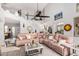 Bright and airy living room with a pink sectional couch, perfect for entertaining guests at 337 E Clairidge Dr, San Tan Valley, AZ 85143