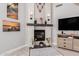 Modern fireplace, stylish furnishings, and decor adorn this well-lit living room at 337 E Clairidge Dr, San Tan Valley, AZ 85143