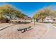 Neighborhood playground with swings, picnic tables, and a seesaw in a Gathering-friendly park at 337 E Clairidge Dr, San Tan Valley, AZ 85143