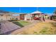 View of a gazebo, table and chairs, desert landscaping and grassy area, and other backyard features at 354 W Bealey Ave, Coolidge, AZ 85128