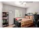 Functional bedroom featuring a ceiling fan, window for natural light, and ample storage space at 354 W Bealey Ave, Coolidge, AZ 85128