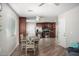 Open-concept kitchen and dining area with modern stainless steel appliances at 354 W Bealey Ave, Coolidge, AZ 85128