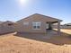 View of the back of house and the spacious backyard at 37056 W Prado St, Maricopa, AZ 85138