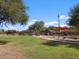 Enjoy the outdoors at the community park with lush green space, picnic areas, and a covered playground at 37056 W Prado St, Maricopa, AZ 85138