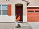 Inviting front door entrance of a house with a covered porch and a well-maintained desert landscape at 37056 W Prado St, Maricopa, AZ 85138