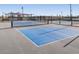 Well-maintained pickleball courts with nets and fencing, ideal for friendly matches and recreational fun at 37056 W Prado St, Maricopa, AZ 85138