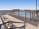 Community pickleball courts enclosed with fencing and benches for spectators to enjoy at 37056 W Prado St, Maricopa, AZ 85138