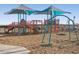 Rancho Mirage community playground with shade structures and climbing features at 37056 W Prado St, Maricopa, AZ 85138