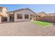 Back exterior featuring neutral stucco, and gravel landscaping at 38672 N Establo Dr, San Tan Valley, AZ 85140