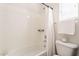 Bright bathroom featuring a tub and shower combination at 38672 N Establo Dr, San Tan Valley, AZ 85140