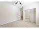 Carpeted bedroom with closet featuring mirrored sliding doors at 38672 N Establo Dr, San Tan Valley, AZ 85140