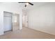 Bedroom featuring carpet and a mirrored sliding door, closet and neutral walls at 38672 N Establo Dr, San Tan Valley, AZ 85140