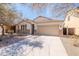 Charming single-story home featuring a two-car garage, desert landscaping, and a stone facade at 38672 N Establo Dr, San Tan Valley, AZ 85140